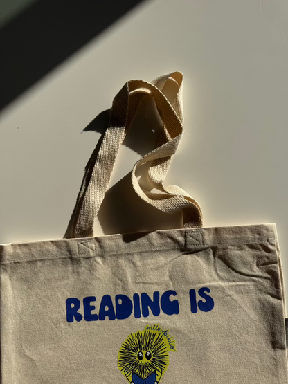 reading is subjective logo tote bag